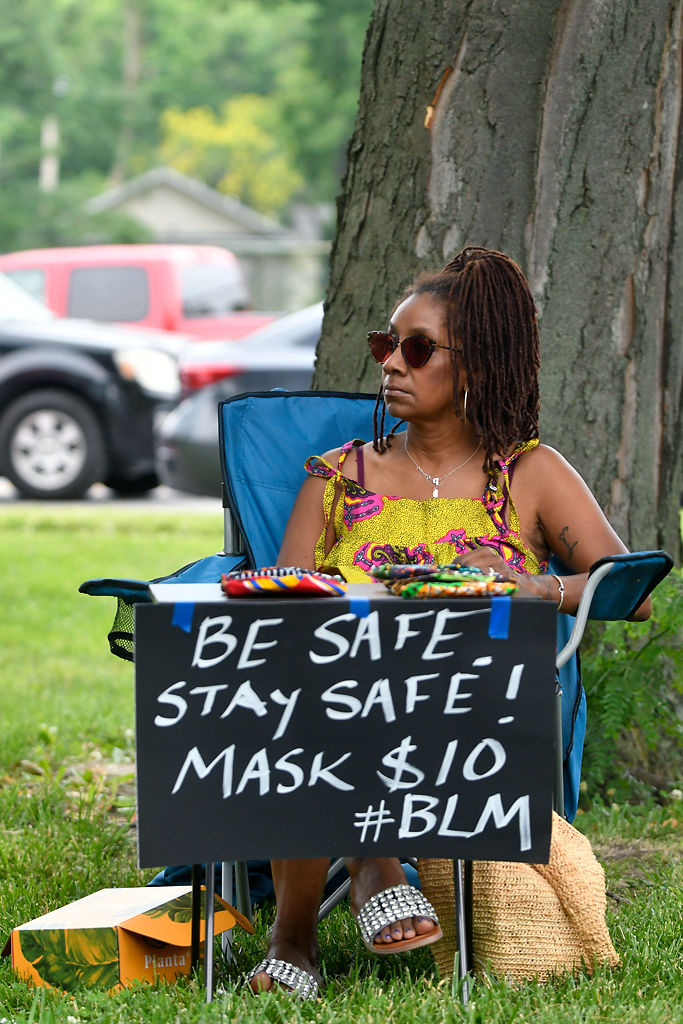 Deborah Greene sits at Douglass Park and sells her handmade mask on Friday, June 19, 2020